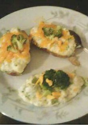 A picture of Broccoli and cheddar cheese twice baked potato.