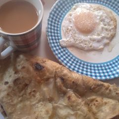 A picture of Anda Paratha with Chai.