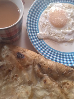 A picture of Anda Paratha with Chai.