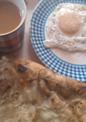 A picture of Anda Paratha with Chai.