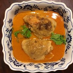 A picture of California Farm Chicken Thighs in Coconut Cream on Pasta.