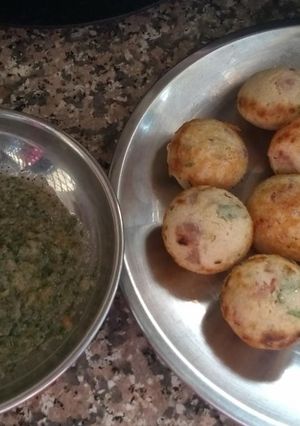 A picture of Appam with green sauce.