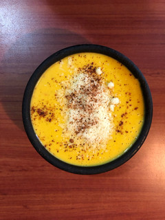Una foto de Crema de zapallo & coco