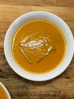 A picture of Carrot and tomato soup.