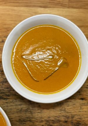 A picture of Carrot and tomato soup.