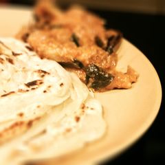 A picture of Kerala Porotta (layered flat indian bread).