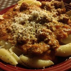 A picture of Italian sausage shells in spicy marinara cream sauce.