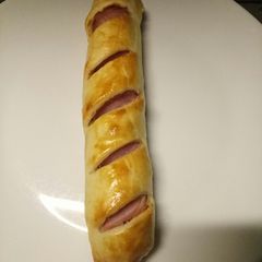 A picture of Sausage and ham roll.
