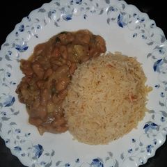 A picture of Rice served with beans.