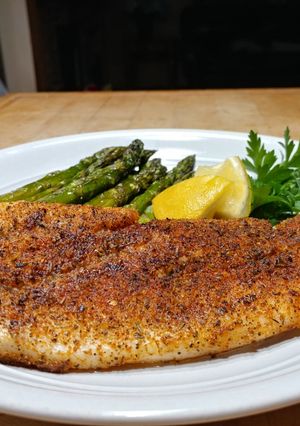 A picture of Oven Baked Blackened Snapper w/ Asparagus.
