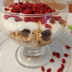 Super healthy breakfast bowl topped with pomegranate seeds A picture of Super healthy breakfast bowl topped with pomegranate seeds.