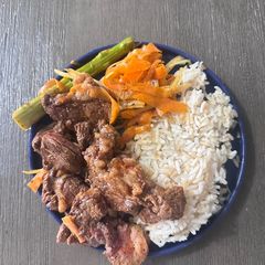 A picture of Garlic Paprika Steak with Rice and Vegetables.