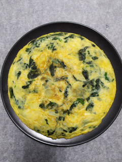 Una foto de Tortilla de patatas y espinacas