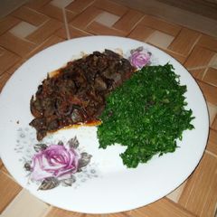 A picture of Green vegetables and wet fry liver.