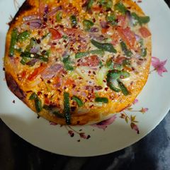 A picture of Homemade Tandoori pizza.