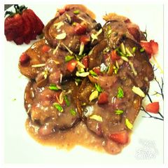 A picture of Strawberry Rabdi Malpua.