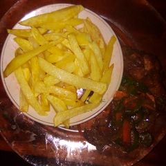 A picture of Fries and fried chicken.
