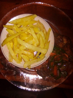 A picture of Fries and fried chicken.