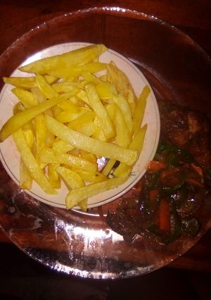 A picture of Fries and fried chicken.