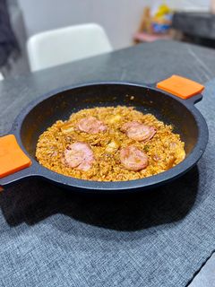 Una foto de Arroz de solomillo y panceta