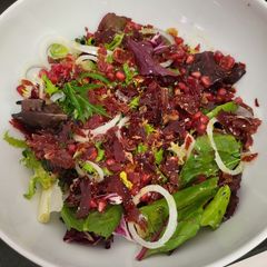 A picture of Salad with crispy Iberian ham and pomegranate.