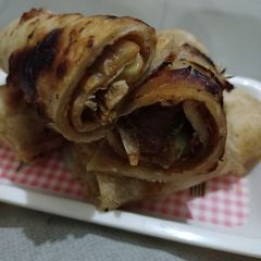 Tikka Boti Paratha Roll A picture of Tikka Boti Paratha Roll.