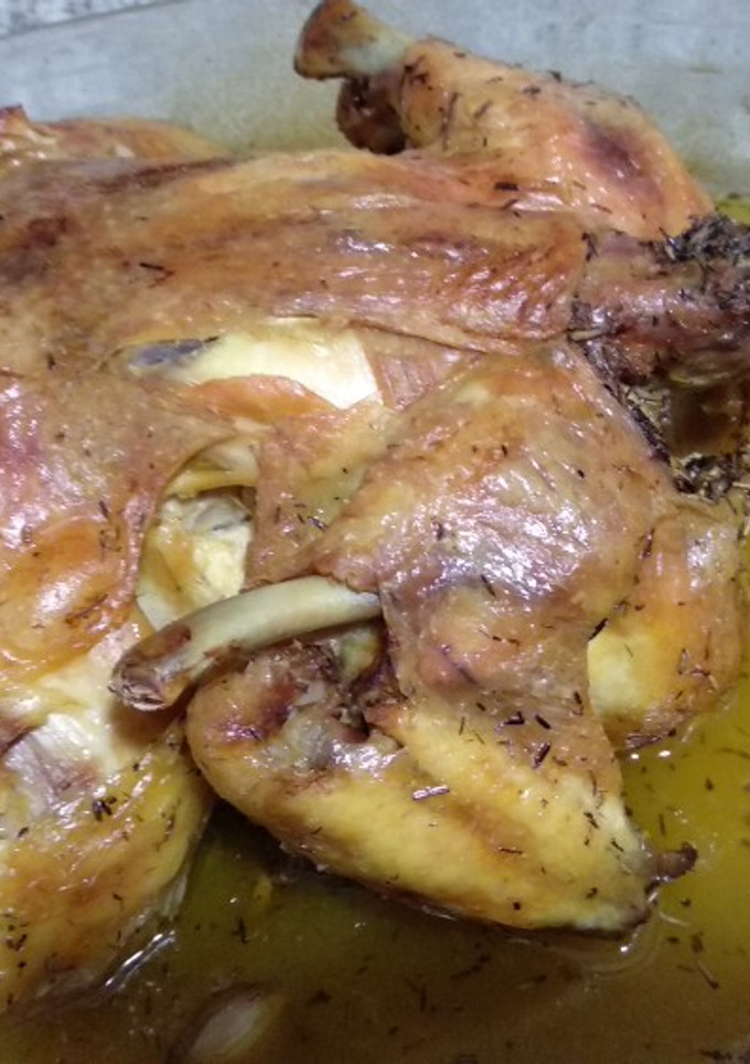 Una foto de Pollo asado lento en su jugo