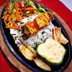 A picture of Veg Paneer Shashlik Sizzler.