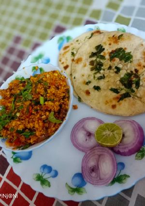 A picture of Bhurji Paneer With Garlic Naan.