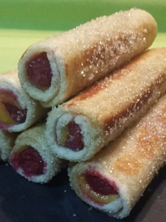Una foto de Canutillos de crema pastelera y frambuesas
