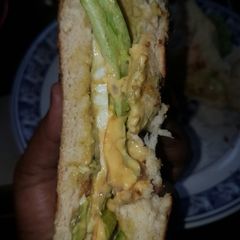 A picture of Sunny side up egg sandwich.