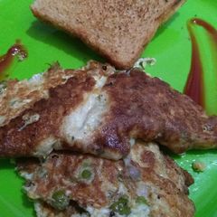 A picture of Brown bread with Egg omelette.