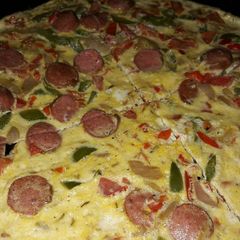 A picture of Sauted veggies, sausage mixed in eggs and bakefried.