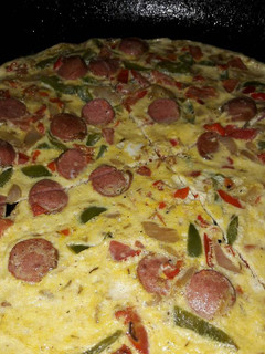 A picture of Sauted veggies, sausage mixed in eggs and bakefried.