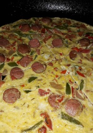 A picture of Sauted veggies, sausage mixed in eggs and bakefried.