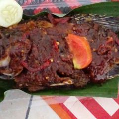 A picture of Grilled Whole Fish with Tamarind, Sweet Soy Sauce and Bento Rice.