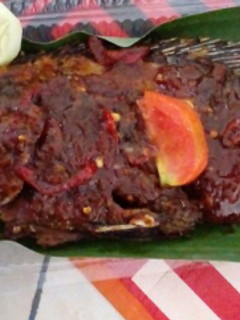 A picture of Grilled Whole Fish with Tamarind, Sweet Soy Sauce and Bento Rice.
