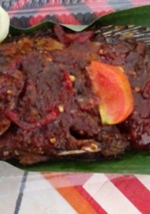 A picture of Grilled Whole Fish with Tamarind, Sweet Soy Sauce and Bento Rice.