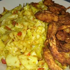A picture of Fried Crispy prawns/shrimps paired with tasty stir fried cabbage.