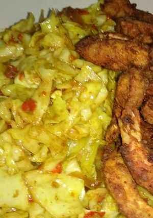 A picture of Fried Crispy prawns/shrimps paired with tasty stir fried cabbage.