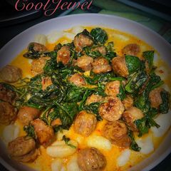 A picture of Italian Sausage with Gnocchi and Spinach.