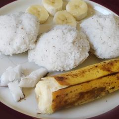 A picture of Sweet Puttu (steamed rice cake from Kerala) with coconut.