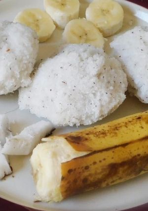 A picture of Sweet Puttu (steamed rice cake from Kerala) with coconut.