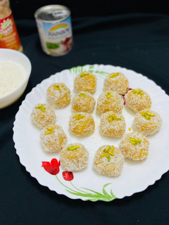 A picture of Mango coconut ladoo with condensed milk.