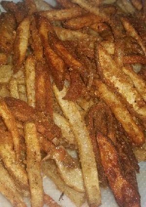 Una foto de Papas empanizadas fritas