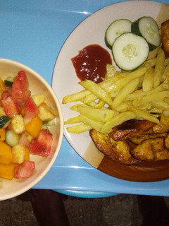 A picture of Chips, plantain with chicken N' Fruit salad!.