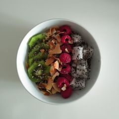 A picture of Pitaya, Kiwi, Rasberry, and Coconut Yogurt Bowl.
