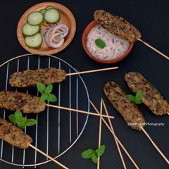 A picture of Grilled Rajma Seekh Kabab with Rajma Dip.