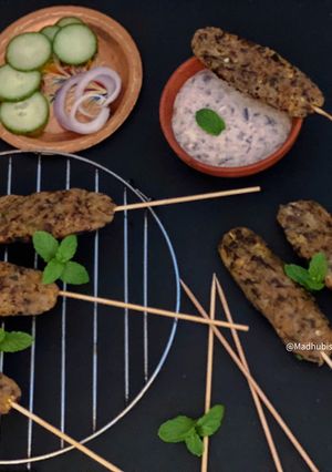 A picture of Grilled Rajma Seekh Kabab with Rajma Dip.