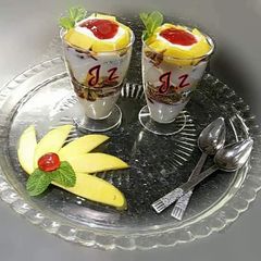 A picture of 🍧🍊🍌🍇🍓Yoghurt Mango & Granola Parfait🍇🍓🍊🍌🍧.